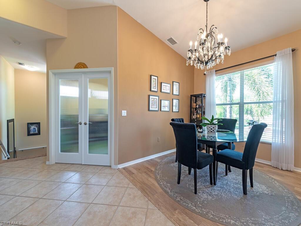 13000 Sandy Key Bend, Unit 3203 North Fort Myers, FL 33903 - Photo 24 of 25 As you enter this second floor residence, the open floor plan with views of the lake will make you feel right at home! A den/flex room with glass doors is to your left along with the dining area and loads of natural light.