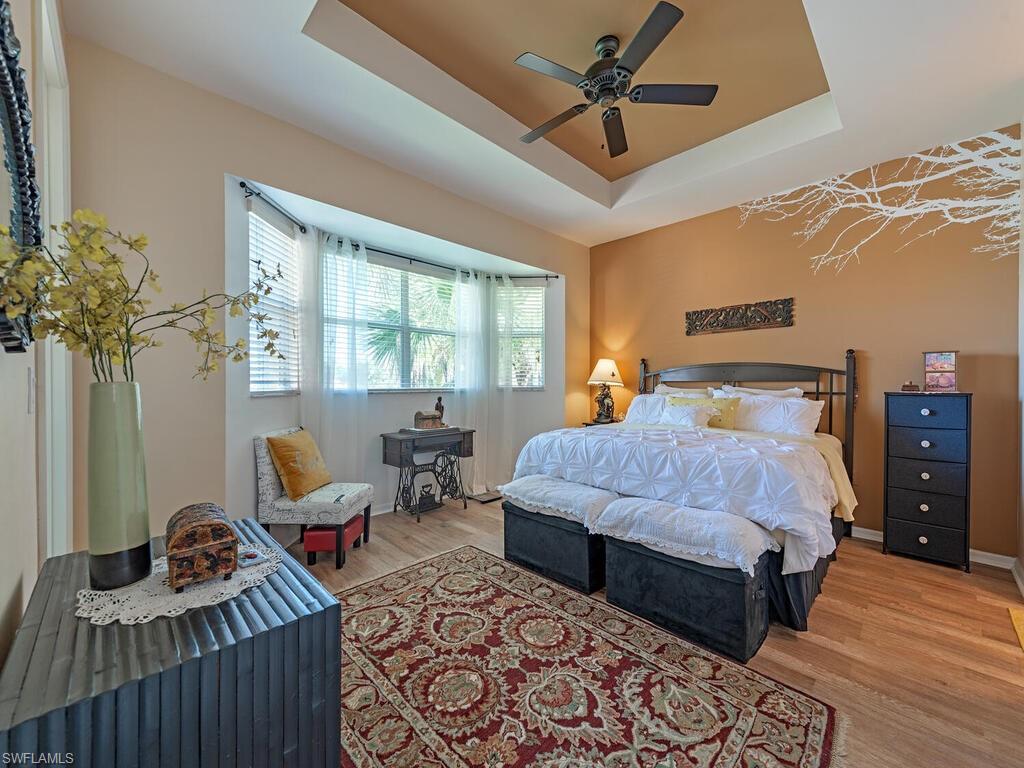 13000 Sandy Key Bend, Unit 3203 North Fort Myers, FL 33903 - Photo 7 of 25 Lovely lake views from the spacious primary bedroom with its high ceilings and ensuite bathroom.