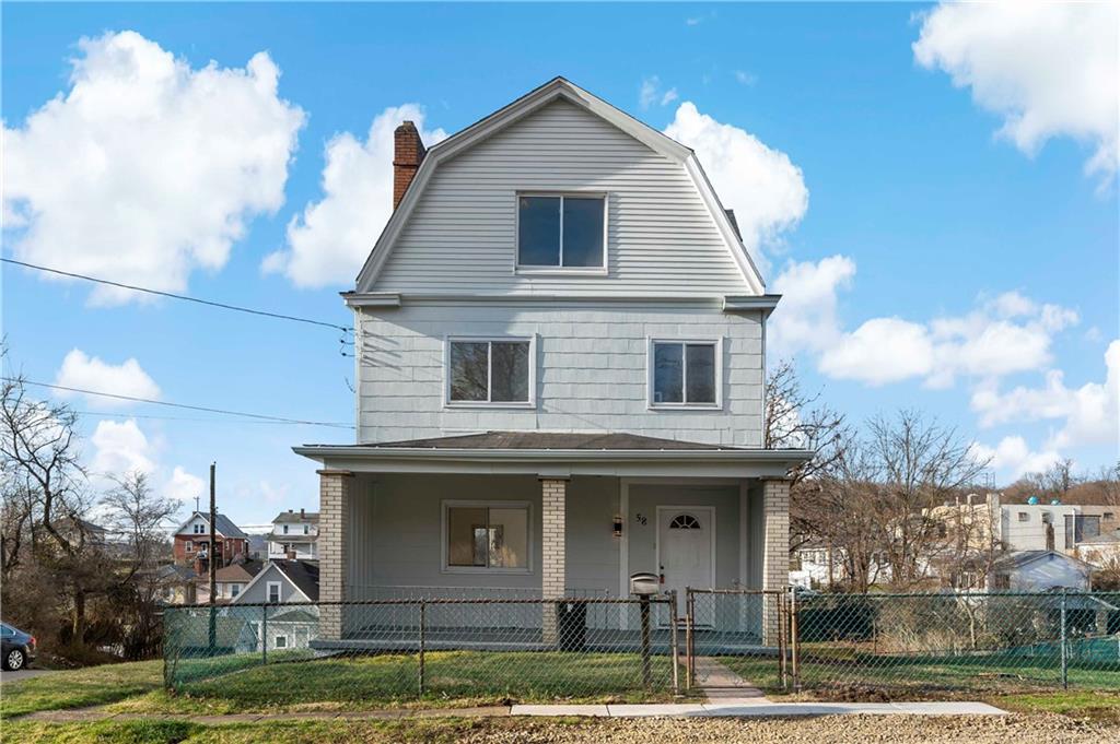 58 Locust Street McKees Rocks, PA 15136 - Photo 1 of 37 a front view of a house with garden