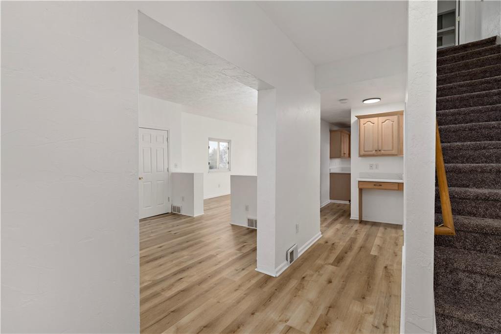58 Locust Street McKees Rocks, PA 15136 - Photo 6 of 37 a view of a room with wooden floor and a kitchen