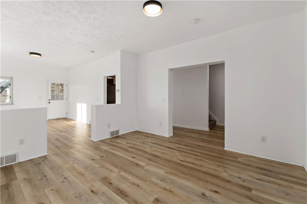 58 Locust Street McKees Rocks, PA 15136 - Photo 8 of 37 a view of a livingroom with wooden floor