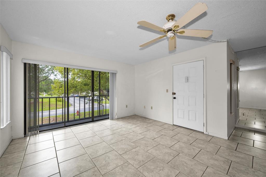 2687 Pine Ridge Way South, Unit B2 Palm Harbor, FL 34684 - Photo 7 of 68 a view of an empty room with a window