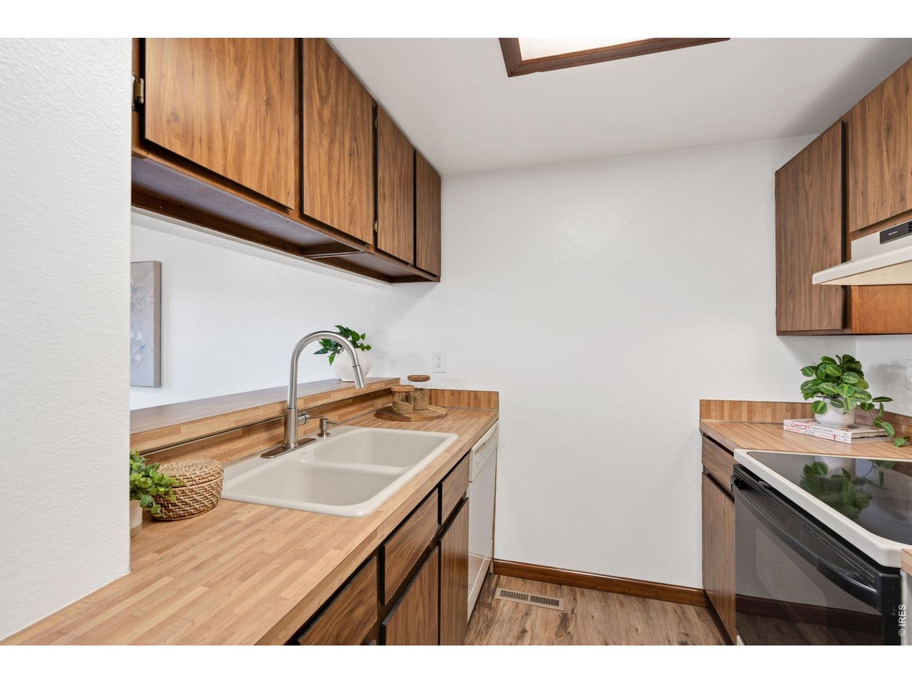 1900 Real Court, Unit A Fort Collins, CO 80526 - Photo 13 of 39 a kitchen with sink cabinets and microwave