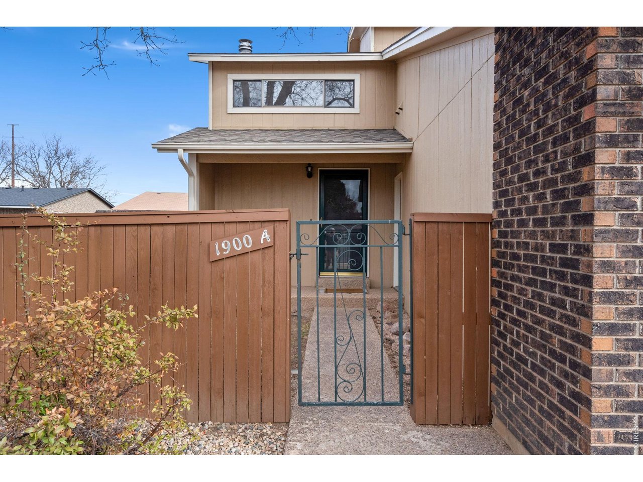1900 Real Court, Unit A Fort Collins, CO 80526 - Photo 2 of 39 a view of a entryway door front of house