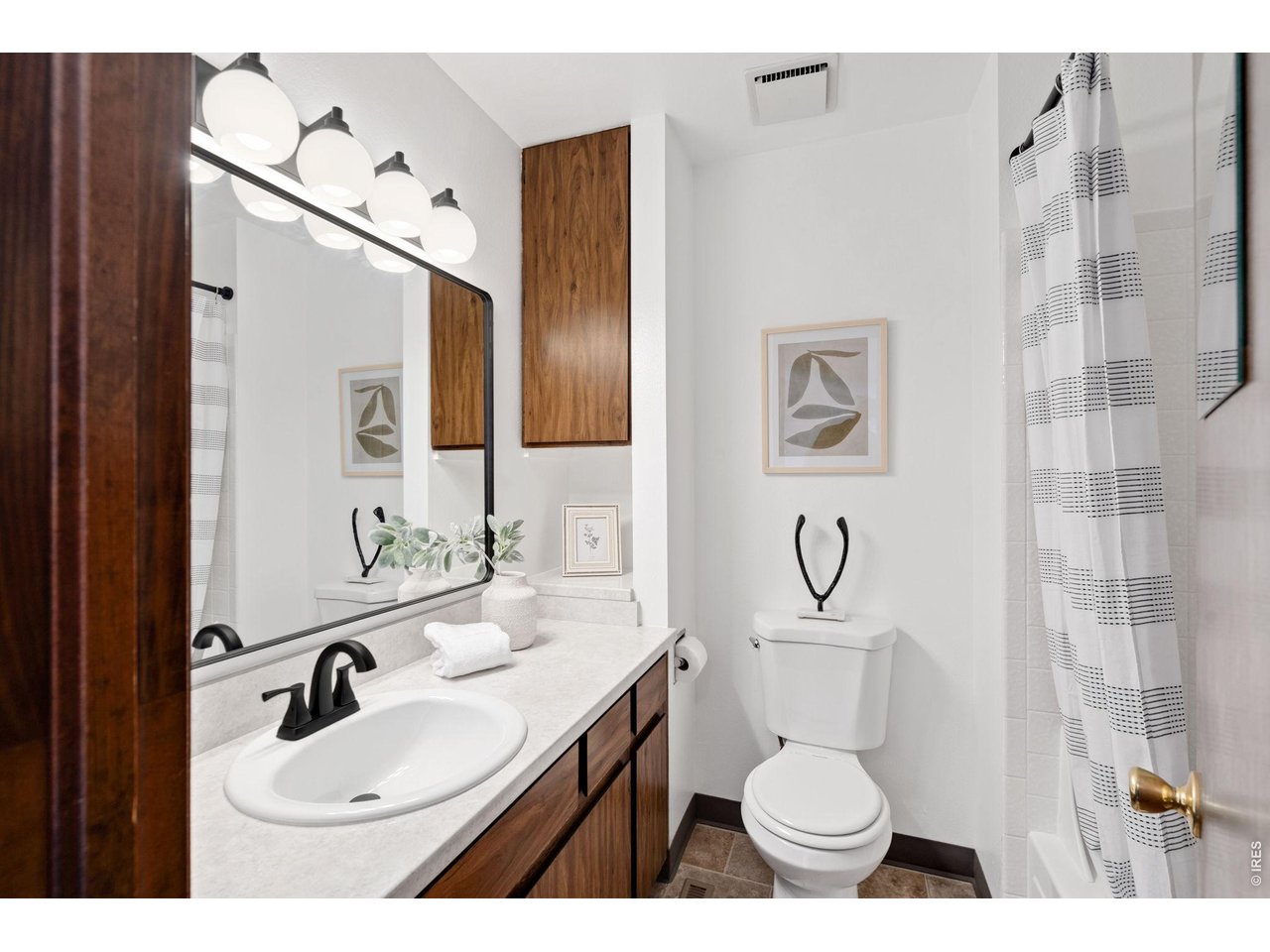 1900 Real Court, Unit A Fort Collins, CO 80526 - Photo 21 of 39 a bathroom with a granite countertop toilet sink and mirror