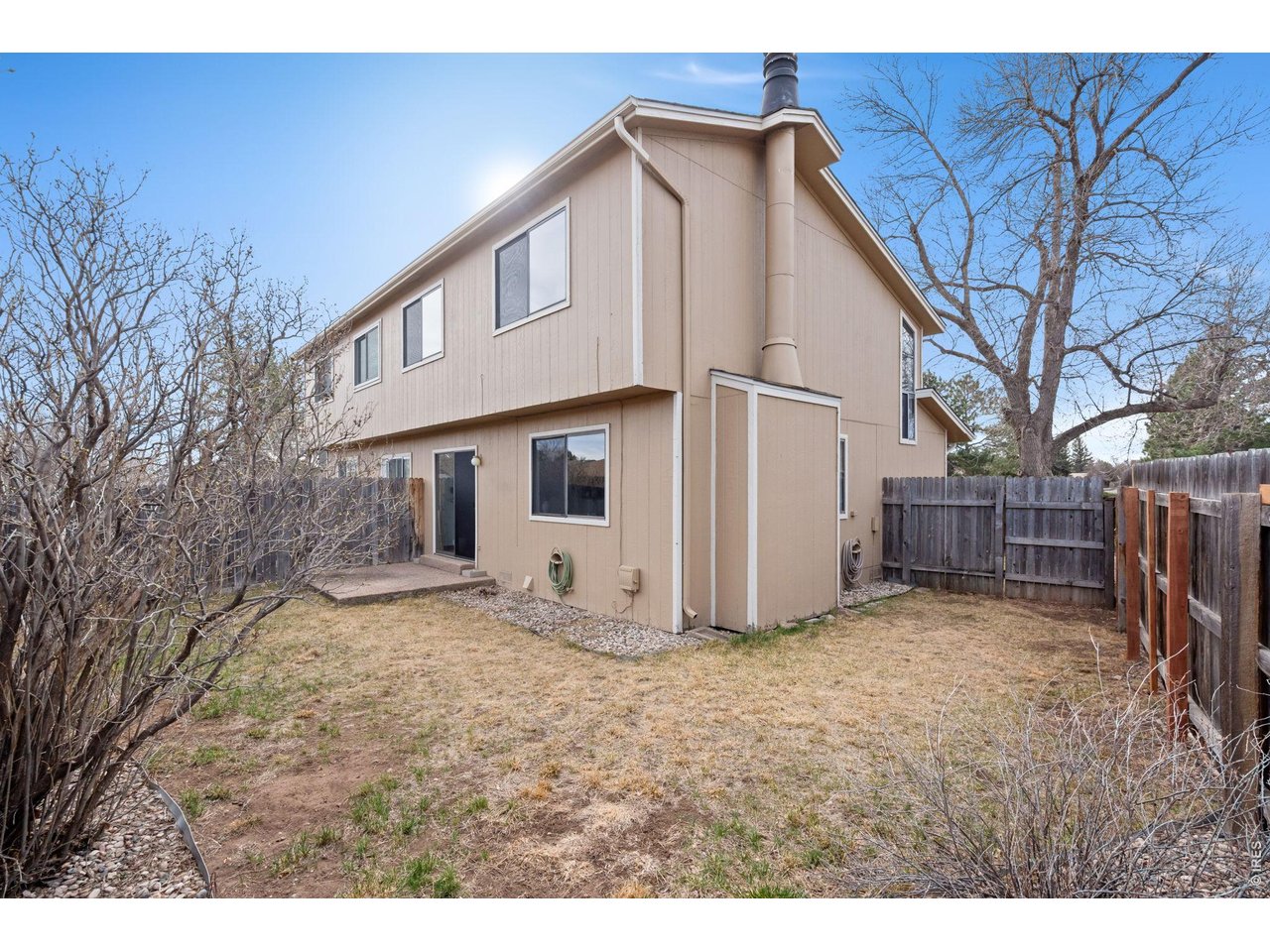 1900 Real Court, Unit A Fort Collins, CO 80526 - Photo 28 of 39 a view of a house with a yard