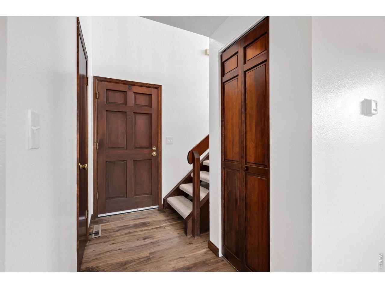 1900 Real Court, Unit A Fort Collins, CO 80526 - Photo 4 of 39 a view of an entryway with wooden floor
