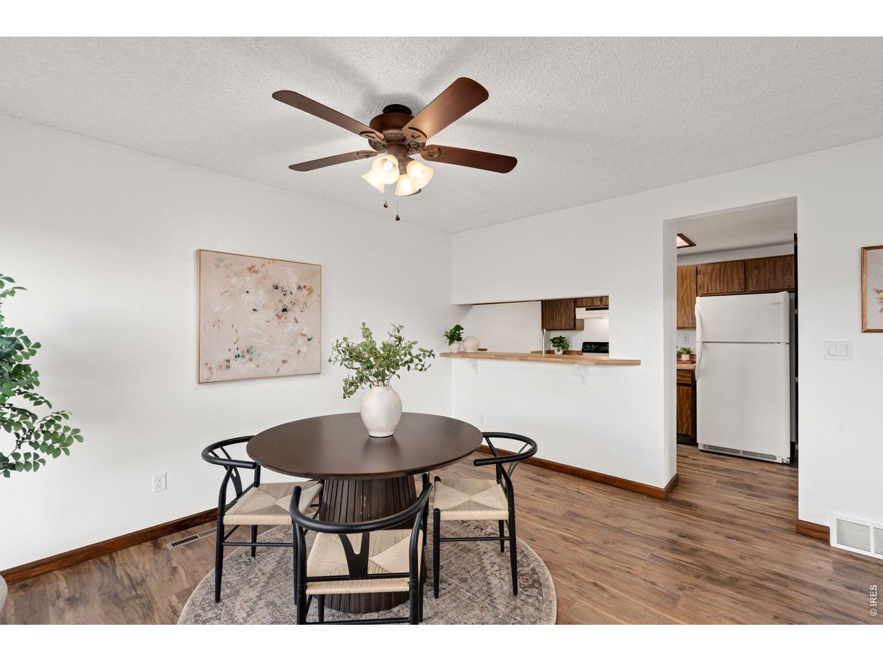1900 Real Court, Unit A Fort Collins, CO 80526 - Photo 10 of 39 a view of a dining room with furniture and wooden floor