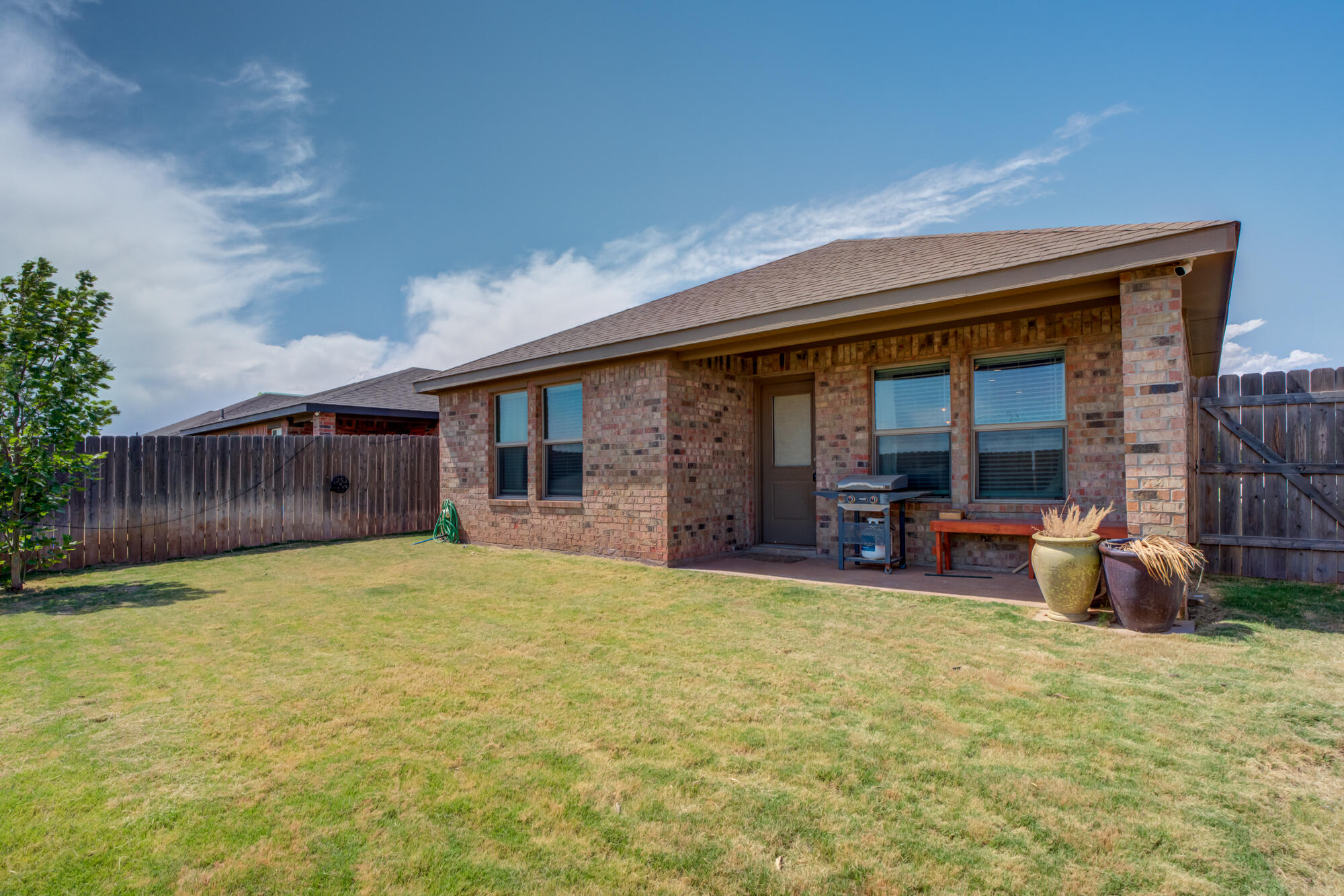 4613 126th Street Lubbock, TX 79424 - Photo 35 of 37 a view of a house with backyard porch and furniture