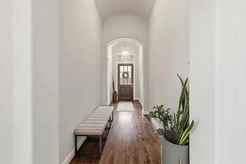 a view of front door with wooden floor