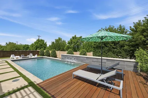 a view of a swimming pool with a patio