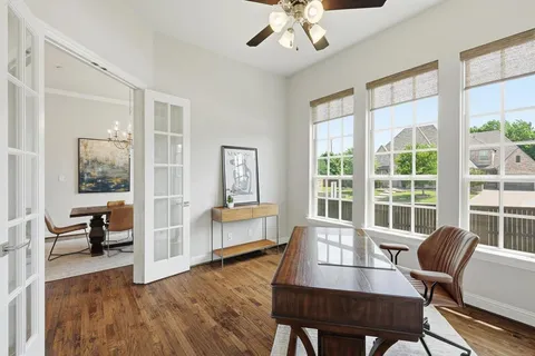 a view of a livingroom with furniture window and wooden floor