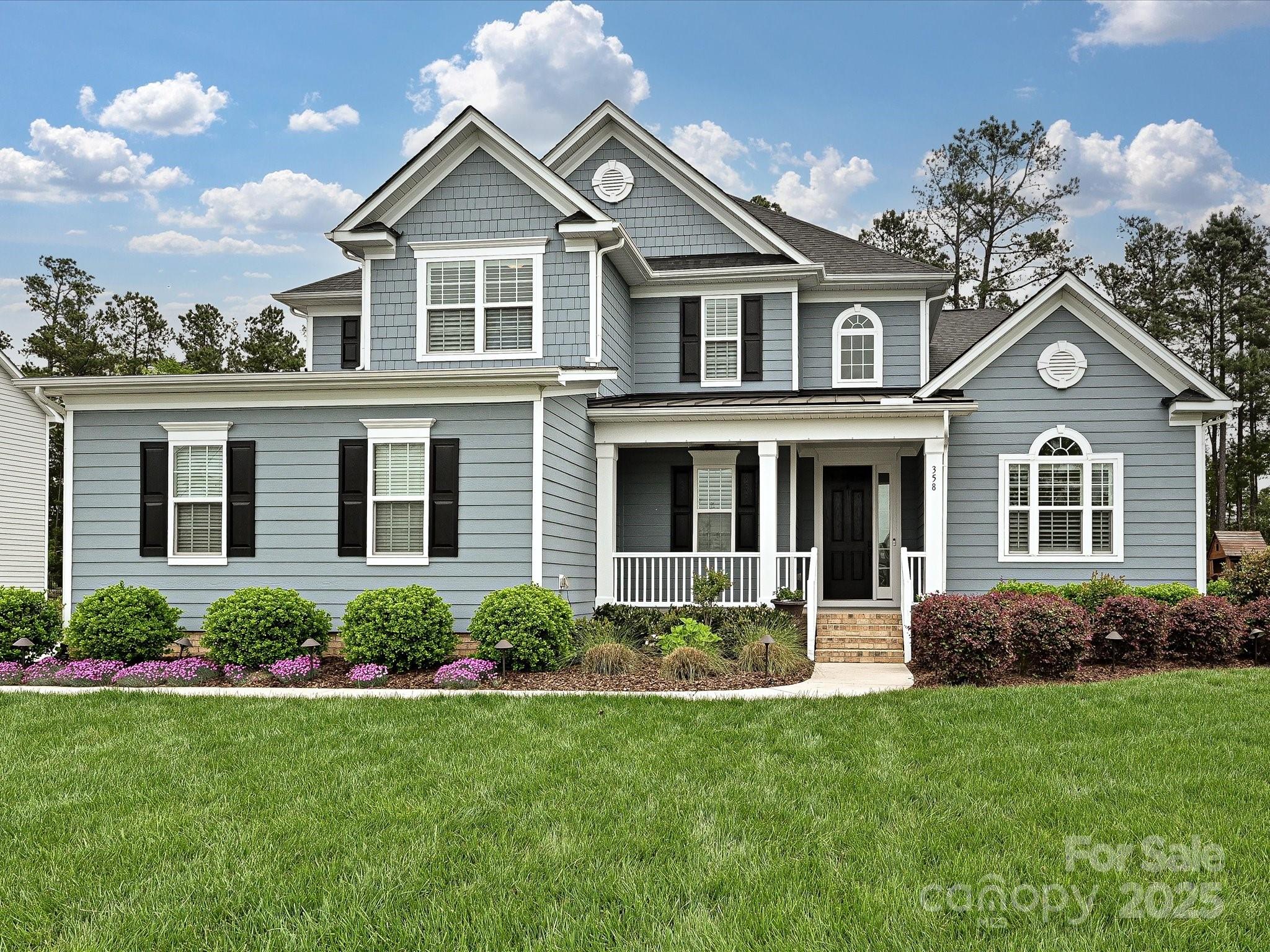 358 Hampton Trail Drive Fort Mill, SC 29708 - Photo 1 of 43 a front view of a house with a yard and porch