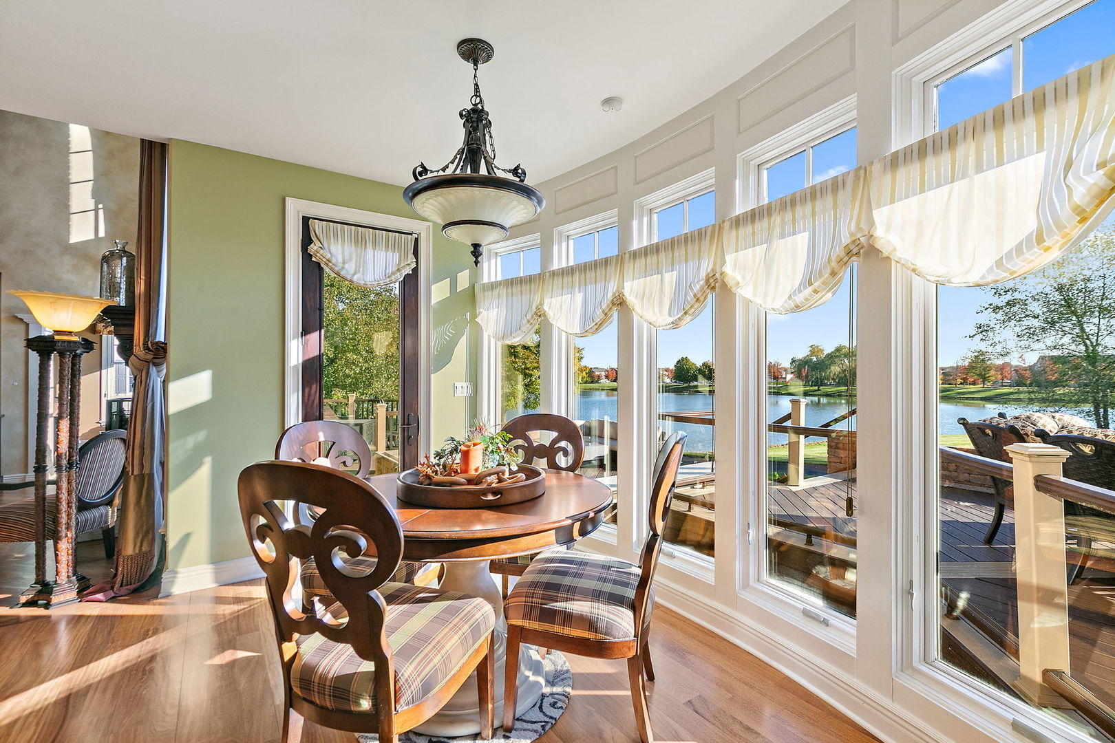 3660 Broadleaf Avenue Elgin, IL 60124 - Photo 19 of 84 a dining room with furniture water view and large windows