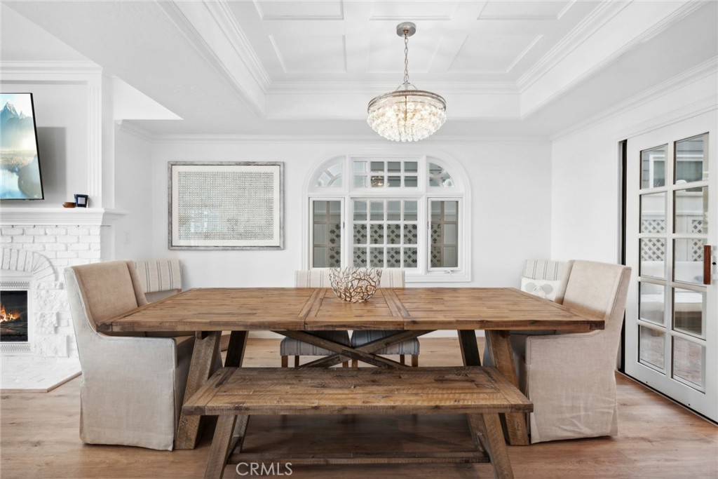 125 Grand Canal Newport Beach, CA 92662 - Photo 14 of 41 a view of a dining room with furniture window and wooden floor