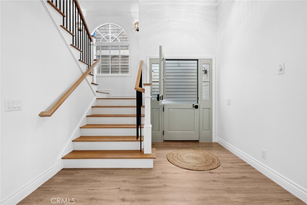 125 Grand Canal Newport Beach, CA 92662 - Photo 18 of 41 a view of entryway with wooden floor and stairs