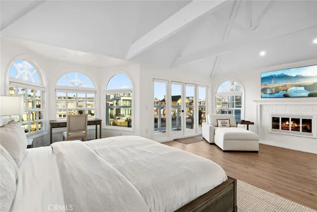 a bedroom with a bed window and couch