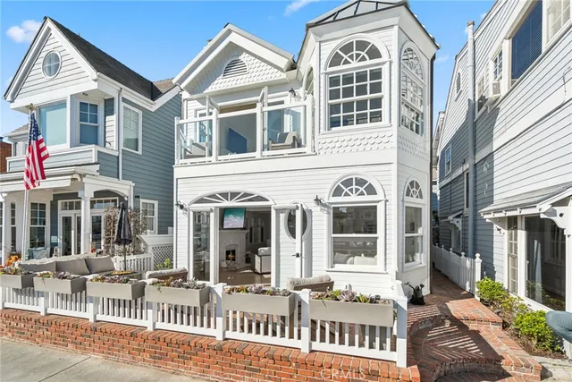 a view of a brick building next to a yard