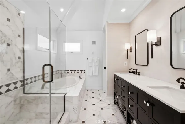a bathroom with a sink double vanity and a mirror