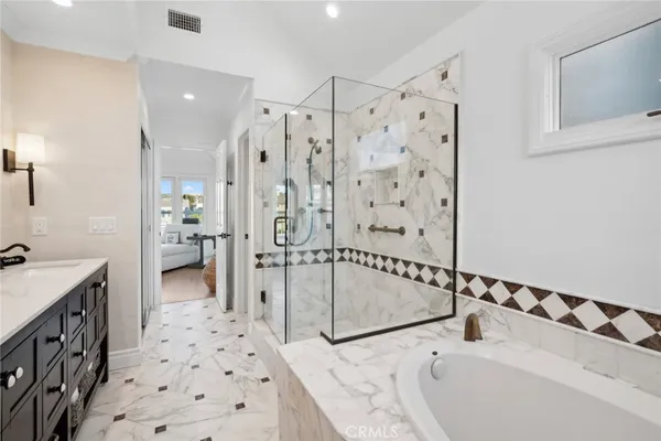 a bathroom with a bathtub sink and toilet