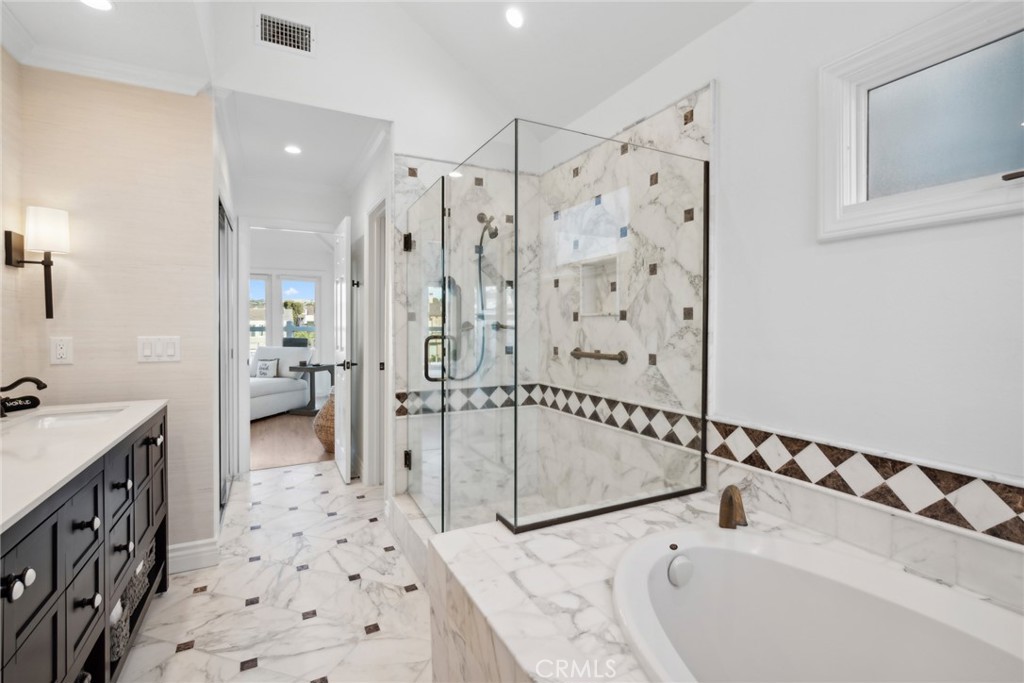 125 Grand Canal Newport Beach, CA 92662 - Photo 24 of 41 a bathroom with a bathtub sink and toilet