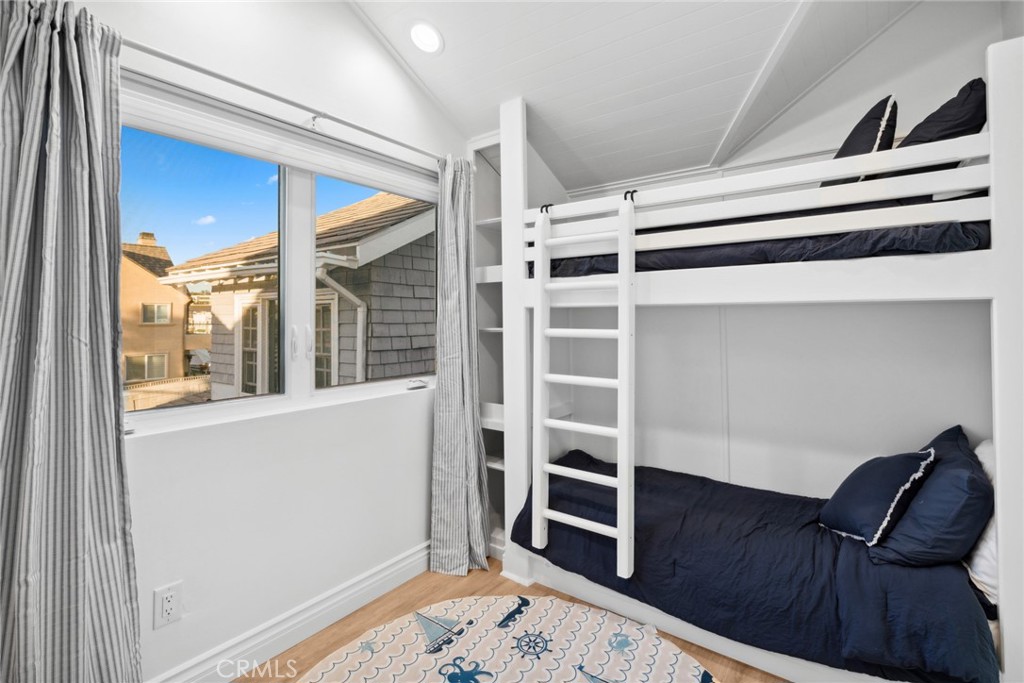 125 Grand Canal Newport Beach, CA 92662 - Photo 25 of 41 a view of bedroom with furniture and wooden floor