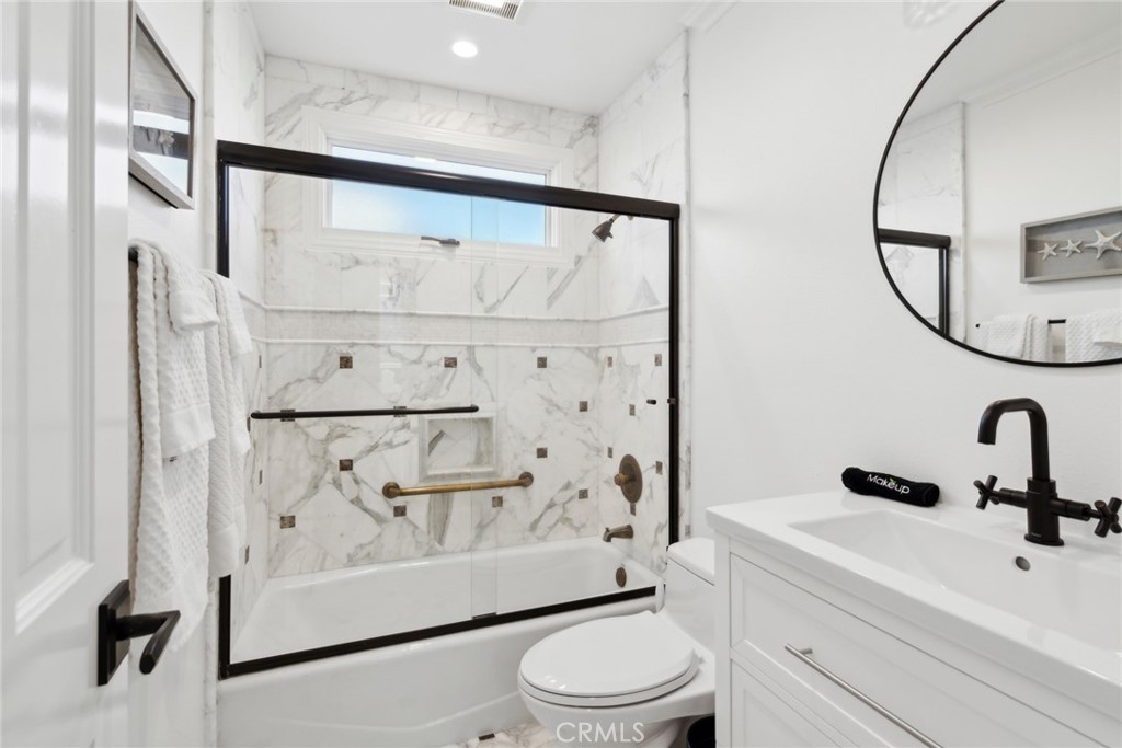 125 Grand Canal Newport Beach, CA 92662 - Photo 26 of 41 a bathroom with a sink toilet and shower