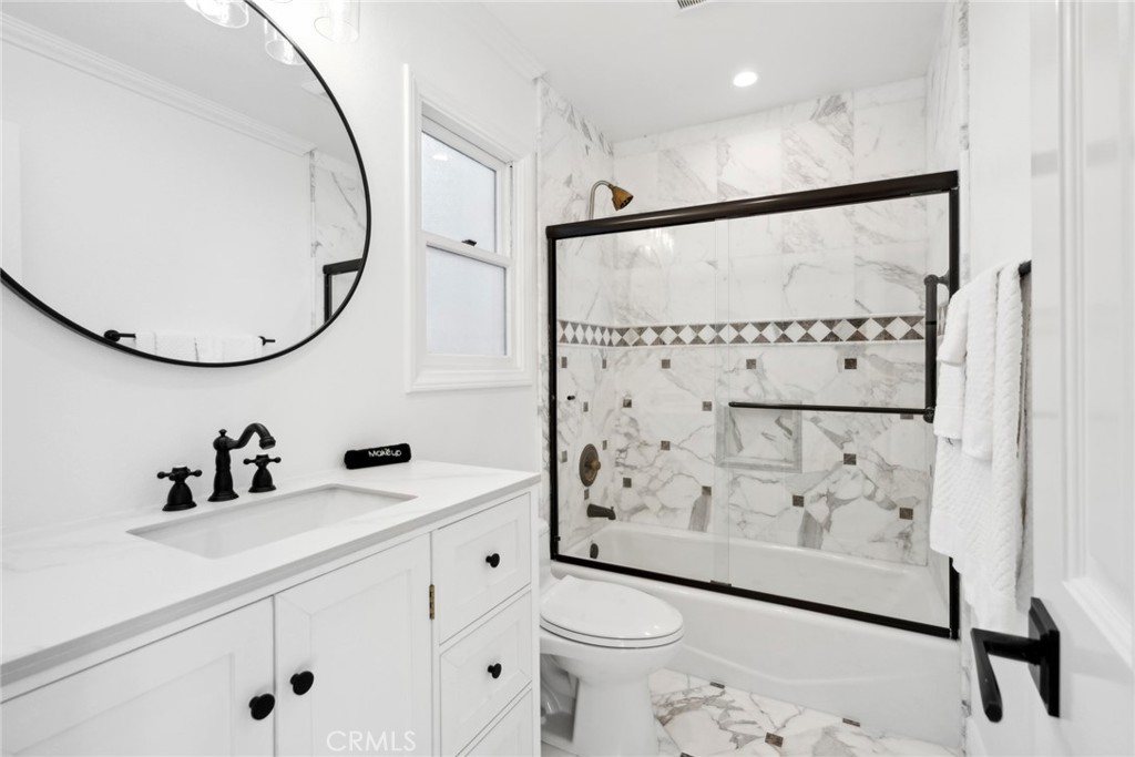 125 Grand Canal Newport Beach, CA 92662 - Photo 30 of 41 a bathroom with a sink toilet and shower