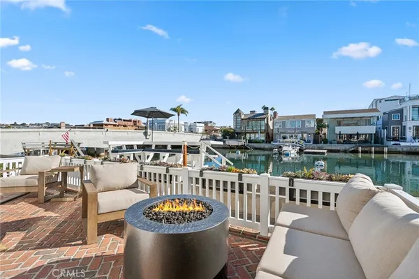 a terrace with outdoor seating city view and barbeque oven