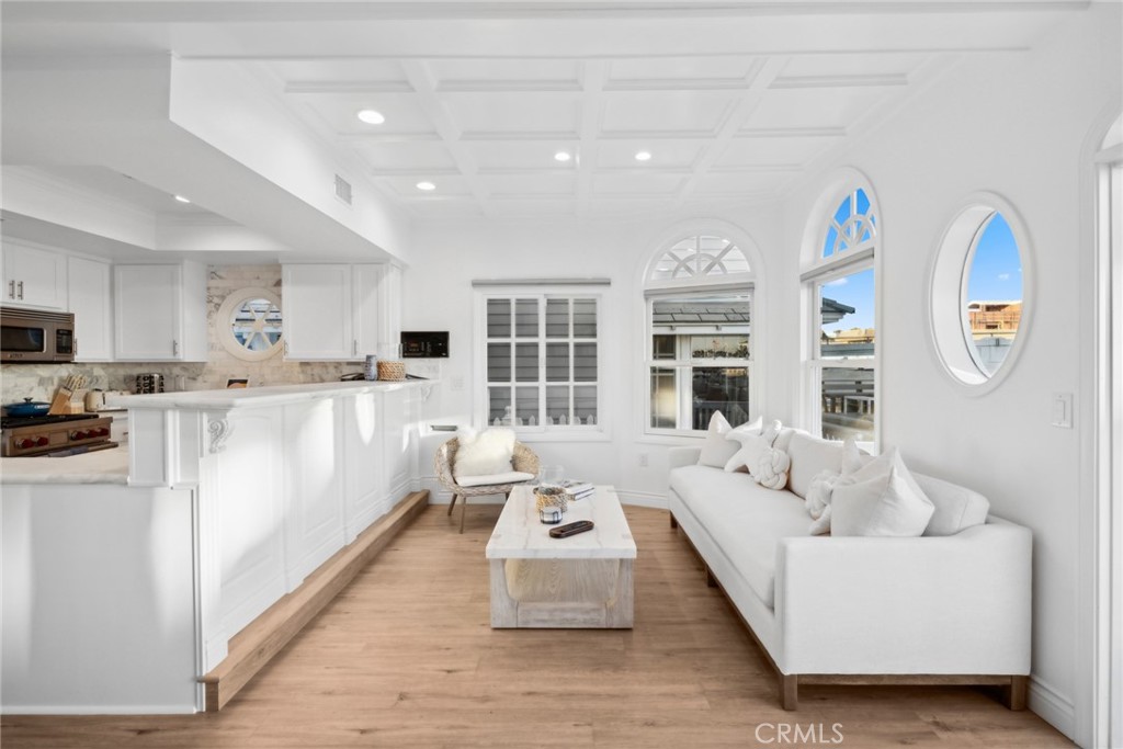 125 Grand Canal Newport Beach, CA 92662 - Photo 7 of 41 a living room with furniture and a table