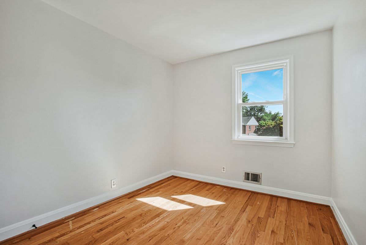 1016 Winsford Road Towson, MD 21204 - Photo 26 of 42 a view of a room with wooden floor and window
