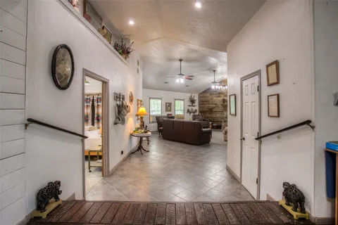 a kitchen with cabinets and window