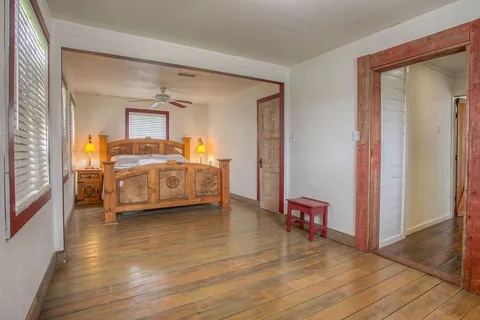 a room that has a bed and a chair in it