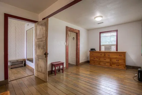 a bathroom with a granite countertop bathtub sink and toilet