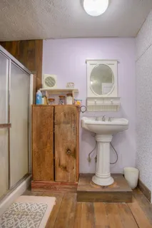 a bed room with a bed and a chandelier