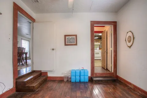 a view of a chair and table in front of a house