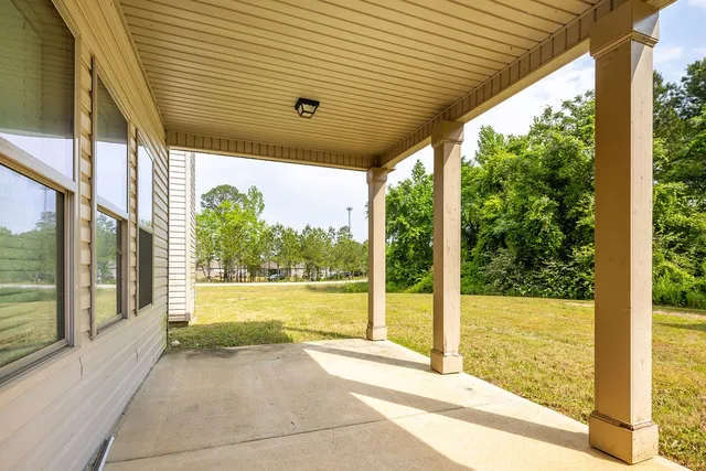 a view of a room with large windows