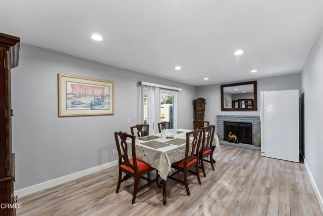 a view of a dining room with furniture wooden floor and chandelier