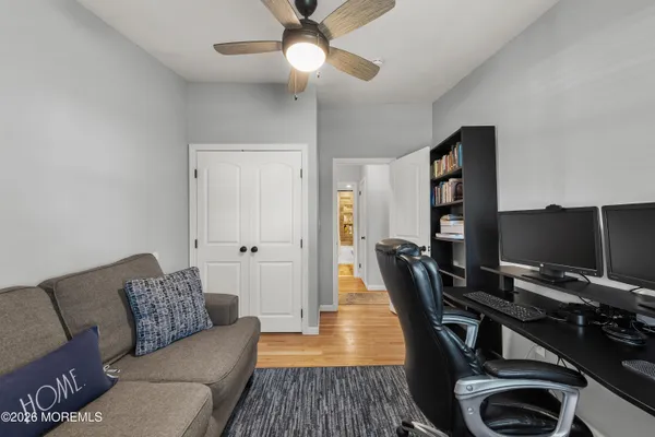 a workspace with furniture and wooden floor
