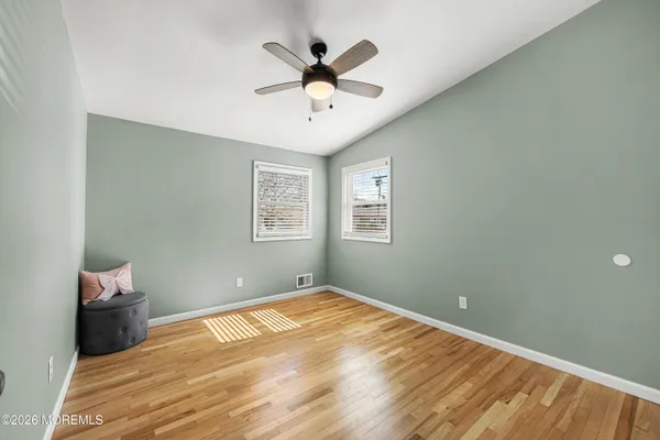 a bedroom with bed and window