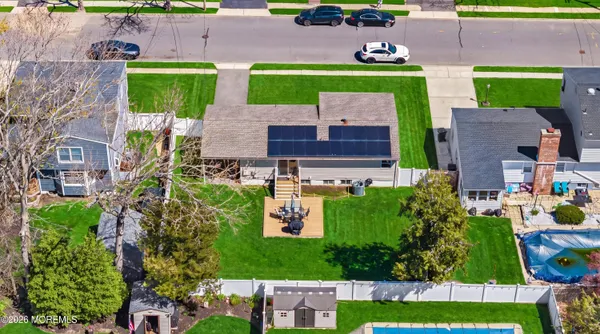 an aerial view of multiple houses with outdoor space