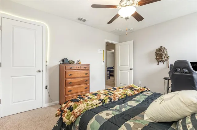 a bedroom with a bed and a closet