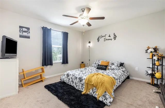 a bedroom with bed and a window