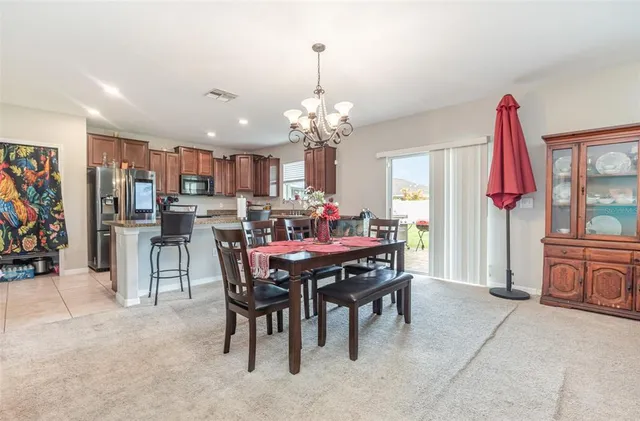a dining room with furniture and window