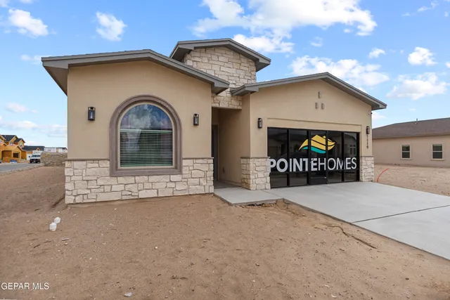 a front view of a house with a garage