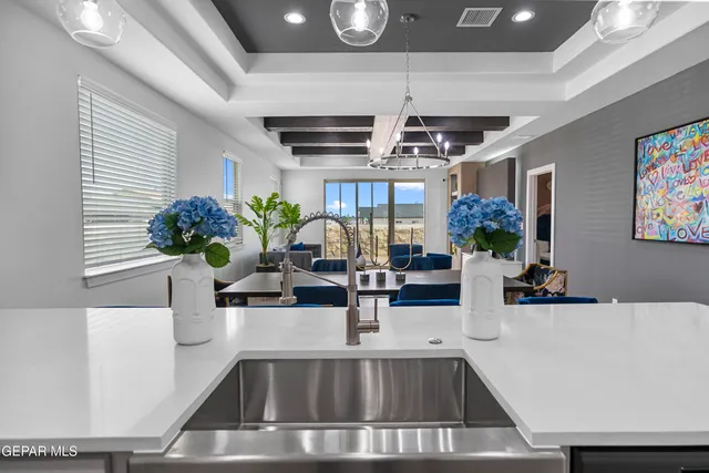a kitchen with a counter top stainless steel appliances and cabinets