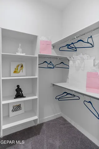 a room with a bed and furniture