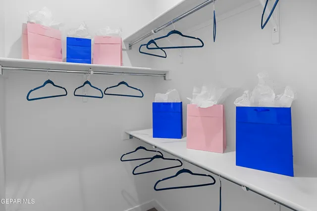 a bathroom with a granite countertop sink mirror vanity and toilet