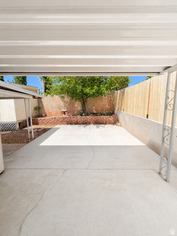 131 Rickie Road Washington, UT 84780 - Photo 4 of 31 Expansive concrete patio with an aluminum patio cover. Plenty of space for a pool!