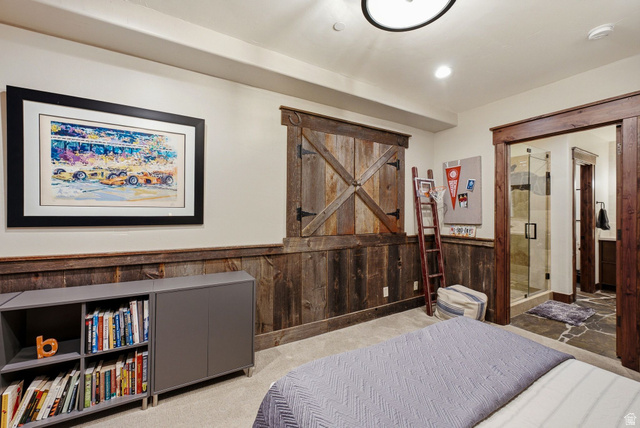 7885 North Rabbitbrush Court, Unit 13 Park City, UT 84098 - Photo 53 of 88 Carpeted room featuring rustic wood wainscoting and barn-style window shutters